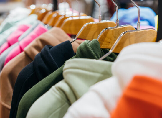 fashion clothing on hangers at the show